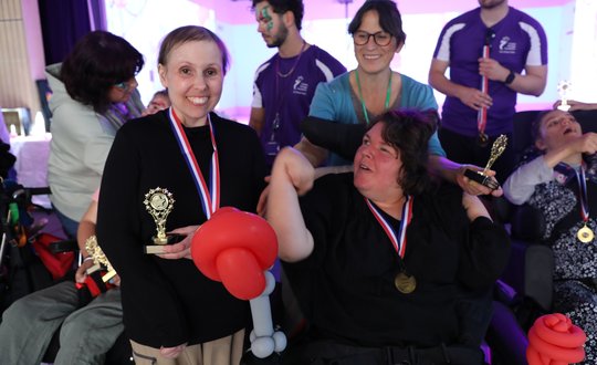 two people with balloon art