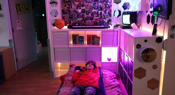 young boy relaxing on his bed