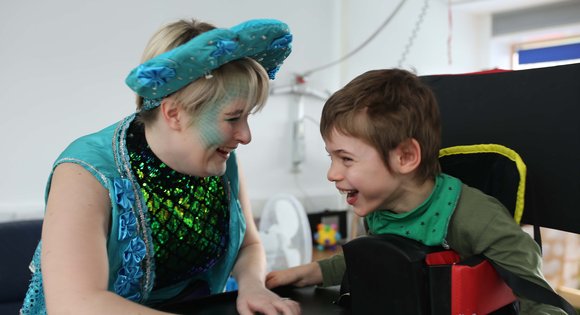 young person and TA smiling
