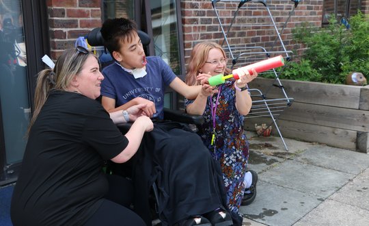 Young person with a water gun